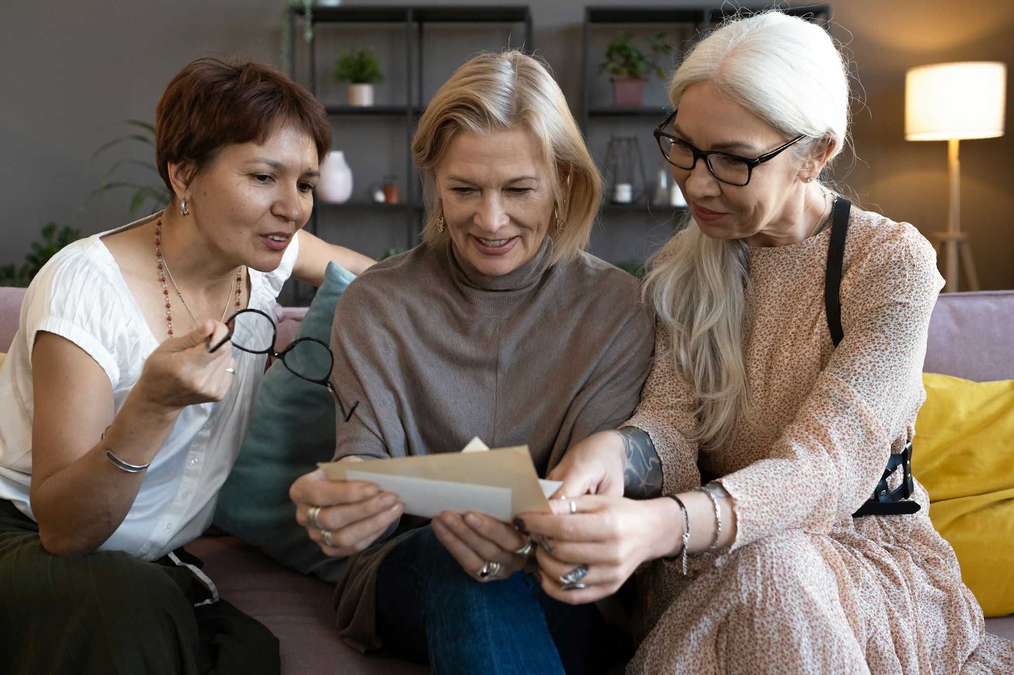 Old friends reading a letter together